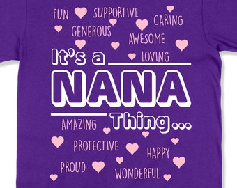 May include: Purple t-shirt with white text that reads "It's a Nana Thing..." with pink hearts and words like "Fun", "Supportive", "Caring", "Generous", "Awesome", "Loving", "Amazing", "Protective", "Happy", "Proud", and "Wonderful" around the text.