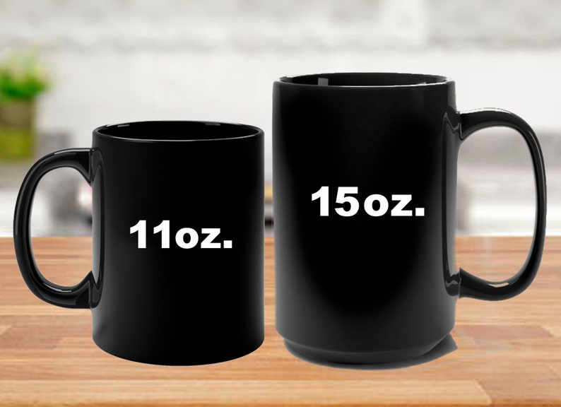 May include: Two black ceramic coffee mugs, one 11oz and one 15oz.