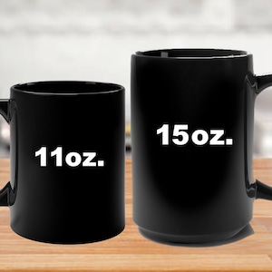 May include: Two black ceramic coffee mugs, one 11oz and one 15oz.