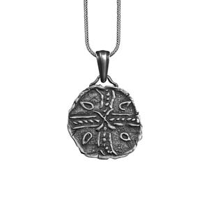 May include: Silver pendant necklace with a round, detailed, silver charm featuring a cross design.