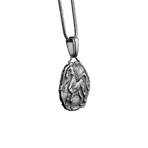 May include: A silver chain necklace with a pendant featuring a detailed, three-dimensional depiction of a mythical creature, possibly a centaur or a griffin.