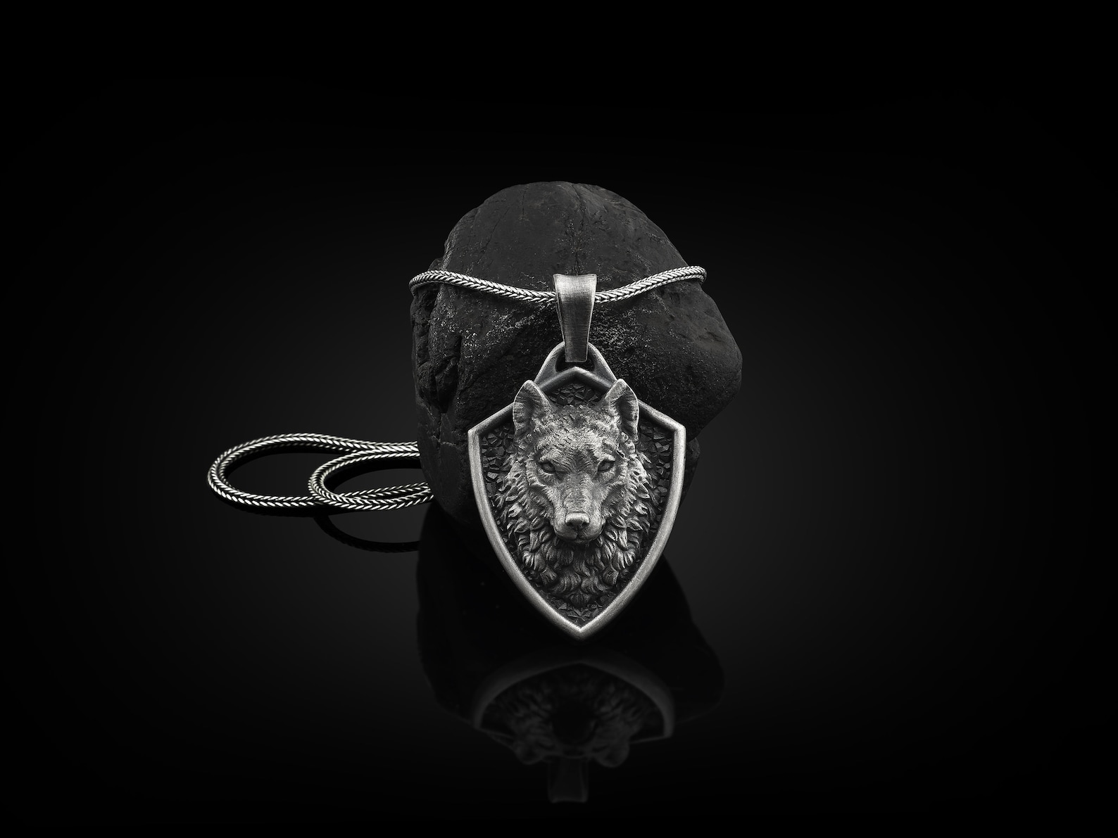 silver wolf pendant on a necklace