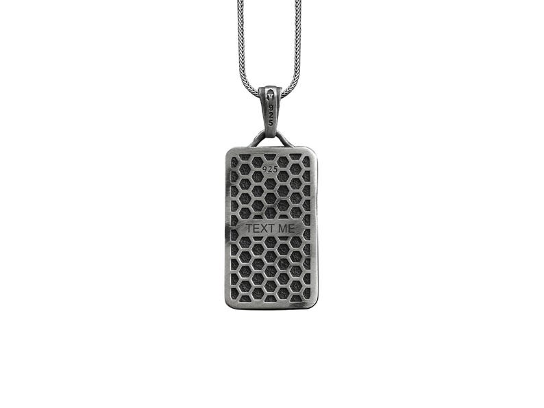 May include: Silver necklace with a rectangular pendant featuring a honeycomb pattern and the text "TEXT ME".
