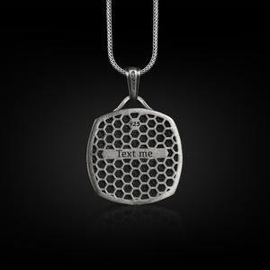 May include: Silver pendant necklace with a square-shaped charm featuring a honeycomb pattern and the text "Text me".