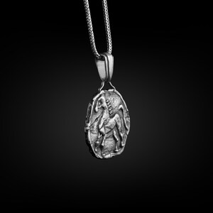 May include: A silver pendant necklace featuring a detailed, three-dimensional design of a horse. The pendant is attached to a silver chain.