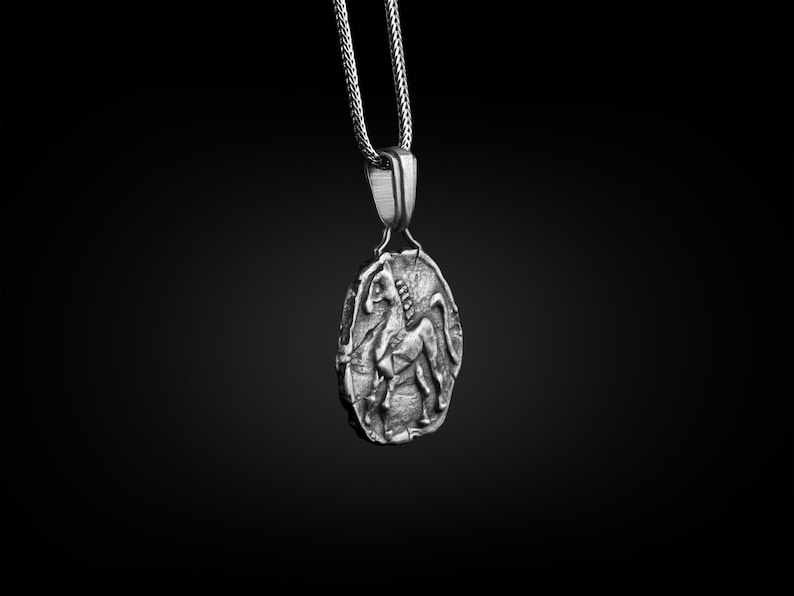 May include: A silver pendant necklace featuring a detailed, three-dimensional design of a horse. The pendant is attached to a silver chain.