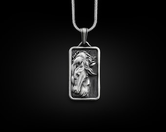 May include: Silver pendant necklace featuring a detailed, three-dimensional design of two horse heads intertwined.