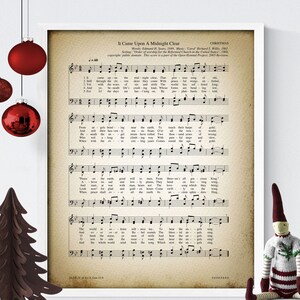 May include: A vintage sheet music print of the Christmas carol "It Came Upon A Midnight Clear". The sheet music is printed on aged paper with a brown tint and features the lyrics and musical notation for the song.