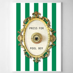 May include: A white button with a gold rim and a small black eye in the center, framed in a gold ornate oval frame. The button is labeled "PRESS FOR POOL BOY" on a white background. The button is set against a background of alternating white and green vertical stripes.