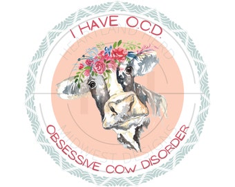 May include: A watercolor illustration of a cow with a floral crown. The cow is wearing a pink headband with the text "I have O.C.D. Obsessive Cow Disorder" in red.