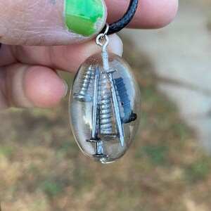 A Fish Inspired Recycled Nail & Screw Resin Necklace - Med Oval