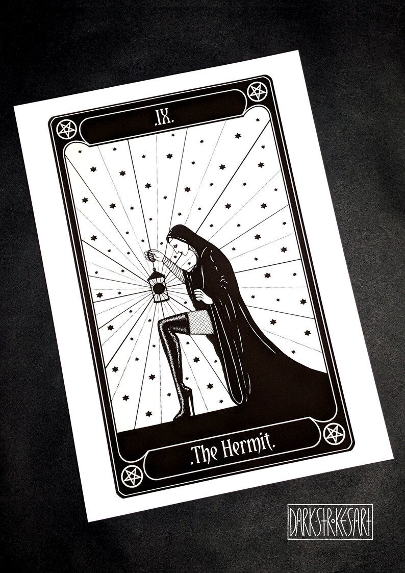 May include: Black and white illustration of The Hermit tarot card. The card features a woman in a hooded robe holding a lantern, with a pentagram in the corner.