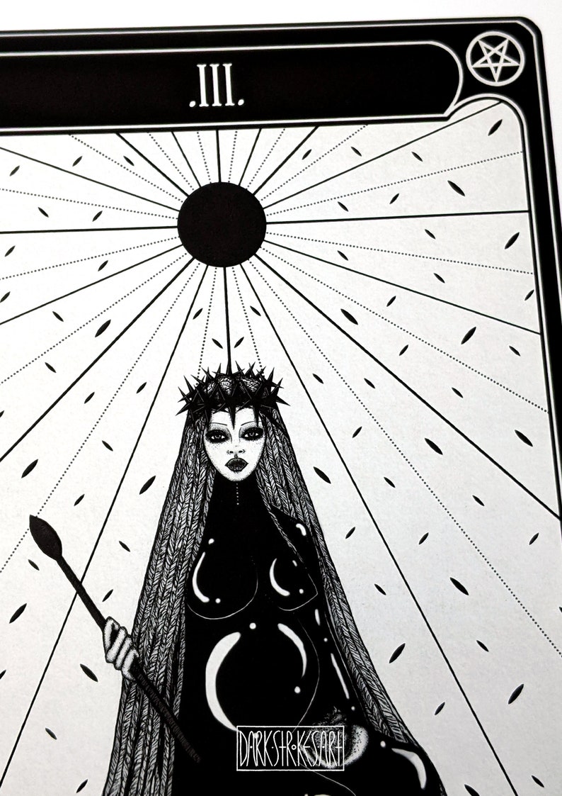 May include: Black and white illustration of a woman wearing a crown of thorns and a long black dress. She is holding a staff and standing in front of a black sun with rays emanating from it. The text "III." is at the top of the image.