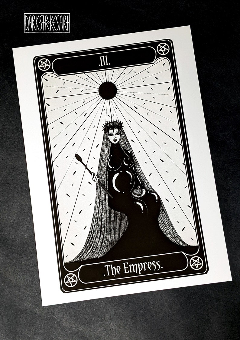 May include: Black and white tarot card illustration of The Empress, card number III. The Empress is depicted as a woman with a crown and long hair, sitting on a throne. She is holding a sceptre in her right hand and a globe in her left hand. The background is a white and black pattern.