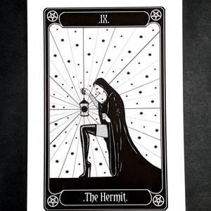 May include: Black and white illustration of The Hermit tarot card. The card features a woman in a hooded robe holding a lantern, kneeling in a field of stars. The card number, "IX", and the card name, "The Hermit", are written in a decorative font.