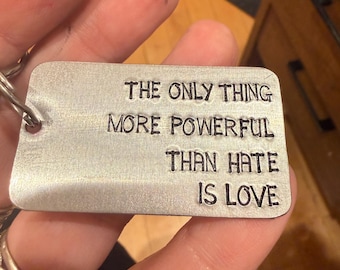 The Only Thing More Powerful than Hate is Love keychain