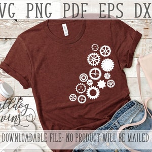 May include: A brown t-shirt with a white design of a cluster of gears on the left side of the shirt. The text "bulldog twins" is written in cursive on the bottom left of the shirt. The shirt is laying on a wooden surface with a pair of headphones, a denim skirt, and a pink purse.