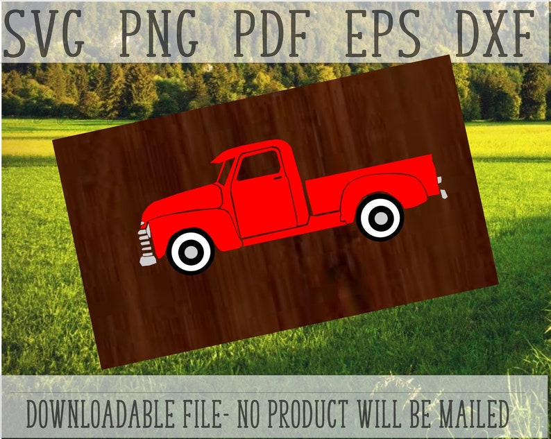 May include: A red vintage pickup truck with white wheels on a brown wood background. The truck is silhouetted against a green grassy field.