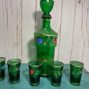 Vintage bohemian green glass decanter, liquor decanter, matching shot glasses, painted red green floral, holiday, barware