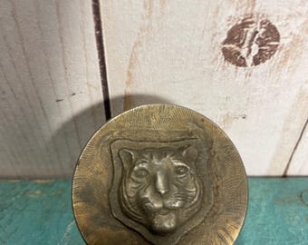 Vintage costume jewelry steel die, Buddhist tiger amulet, Providence RI