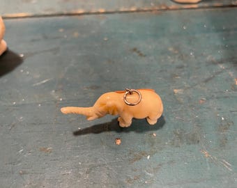 Vintage celluloid or bone elephant charm, marked FRANCE, good luck charm, crackerjack prize style