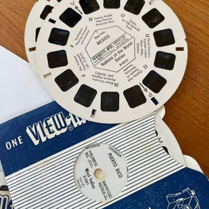 May include: A white View-Master reel with black images of various locations around the world. The reel is labeled "Nations of the World Series" and includes locations like Mexico, Oaxaca, and Puerto Rico.