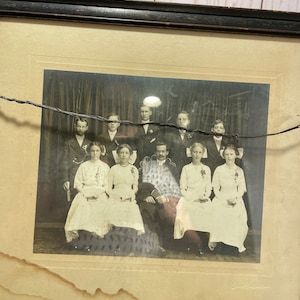 Oddly attractive wooden frame, instant relatives, printing ephemera, dark academia, found art, photo shop, graphic design