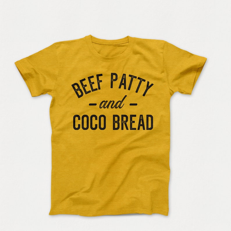 May include: A mustard yellow t-shirt with black text that reads "BEEF PATTY -and- COCO BREAD".