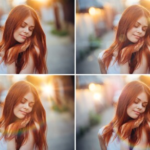 May include: A woman with long, red hair is standing in a street with a blurred background. She is wearing a white tank top and has her eyes closed. The sun is shining brightly behind her, creating a lens flare effect.