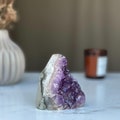 Strange specimen Amethyst geode, raw purple crystal cluster product logo