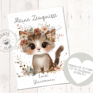 Puede incluir: Una tarjeta blanca con un lindo gato de dibujos animados que lleva una corona de flores. La tarjeta dice "Meine Zeugnisse" y "Luise Glanzmann". Hay una forma de corazón gris con el texto "Mappe mit 20 Follen Für 40 Zeugnisse Größe A4".