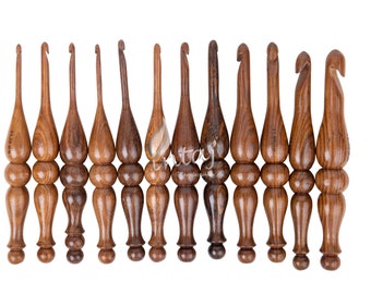 May include: Set of 12 wooden crochet hooks in various sizes. The hooks are brown and have a smooth, polished finish. Each hook has a rounded head and a comfortable grip.