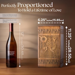 Rosewood hummingbird urn shown next to a wine bottle for scale comparison. Illustrates the physical size of this wooden cremation urn, featuring the clear hummingbird and floral design. Helps visualize the memorial box dimensions.