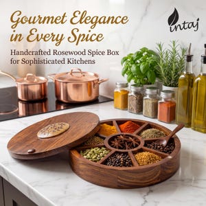 Handcrafted rosewood spice box by INTAJ, round masala dabba with 9 compartments for spices, herbs or dry fruits. Features intricate floral carving on the lid, smooth polished finish and food-safe interior, perfect wooden spice box and kitchen organizer for everyday cooking. Beautiful boho farmhouse décor accent and thoughtful housewarming, wedding or Christmas gift for home chefs and spice lovers, 8.8 inch Indian spice box for countertop storage.