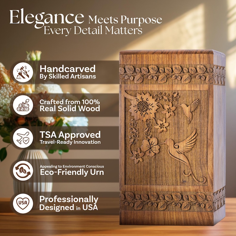 Rosewood hummingbird urn displayed respectfully on a wooden mantelpiece next to a small vase of flowers. Shows the urn in a home setting, highlighting its decorative quality as a beautiful floral memorial. Provides context for the adult urn size.