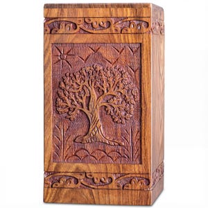 Rosewood Tree of Life urn with peaceful birds, handmade from solid, legally sourced wood, shown in multiple lifestyle scenes for ashes burial, home memorial display, columbarium niches and scattering in nature. Features secure sliding bottom opening with screw, TSA-approved design for travel, and size options from keepsake to XX-large family urn. Warm, comforting finish blends with modern décor, creating a meaningful, dignified tribute and thoughtful sympathy gift.