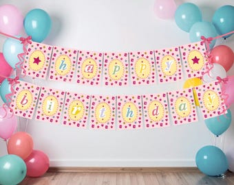 May include: A pink banner with the words "Happy Birthday" in a whimsical font, decorated with stars and hearts. The banner is strung between colorful balloons in shades of pink, blue, and coral, creating a festive atmosphere.