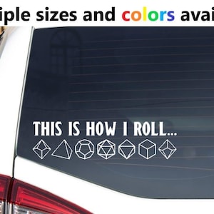 May include: White vinyl decal applied to a car window. The decal reads "THIS IS HOW I ROLL..." with various dice shapes below the text. The text "Multiple sizes and colors available" is at the top.