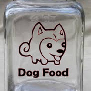 May include: A clear glass jar with a black lid and a red cartoon dog design. The jar says "Dog Food" in red letters.