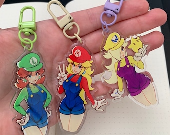 Peach, Daisy, and Rosalina (in Mario, Luigi, and Wario’s clothes) Charms