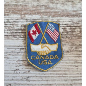 Vintage Canada USA Friendship Handshake Crossed Flags Embroidered Patch Shield