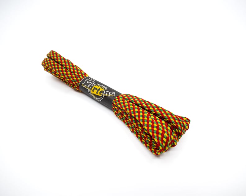 May include: Red, yellow, and green striped shoelaces with a black Dr. Martens label.