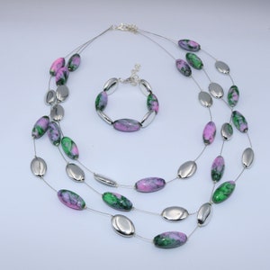 Handmade jewelry set, necklace and bracelet made of oval glass beads painted in shades of purple and green and flat silver beads