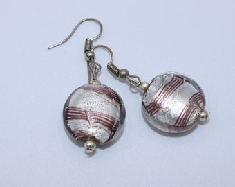 Simple and elegant handmade earrings of flat transparent glass bead with silver heart and purple lines