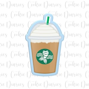 May include: A blue and white cookie cutter shaped like a coffee cup with a mermaid tail logo. The cup has a white lid and a brown coffee-coloured liquid inside.