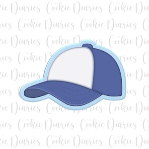 May include: A blue and white baseball cap shaped cookie cutter with a light blue border. The design features a solid white front panel and a blue brim, side, and back panel, creating a clear outline of a classic cap silhouette for baking.