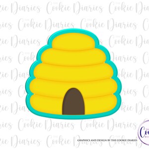 May include: A yellow and turquoise beehive cookie cutter. The cookie cutter is shaped like a beehive with a round entrance at the bottom.