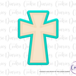 May include: A teal and beige cross-shaped cookie cutter. The cutter has a teal outline and a beige interior with detailed lines. The design is from The Cookie Diaries.