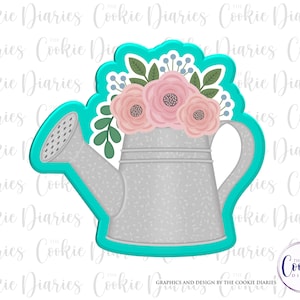 May include: A turquoise blue cookie cutter shaped like a watering can with a floral design. The watering can is gray with a speckled texture and has a spout and a handle. The flowers are pink and white with green leaves.