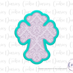 May include: A turquoise blue cookie cutter in the shape of a cross with a damask pattern inside. The cutter is designed for baking and decorating cookies.
